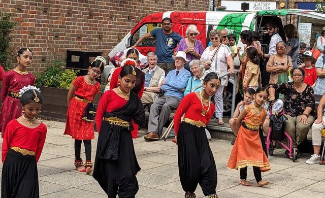 Photograph showing children dancing a traditional dance at Amersham Refugee Week 2023